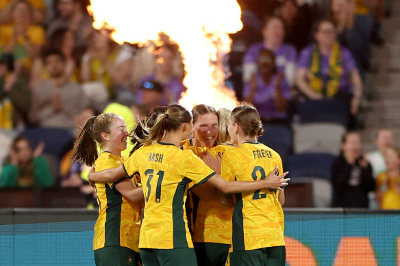 Tash Prior of the Matildas celebrates a goal with her teammates.