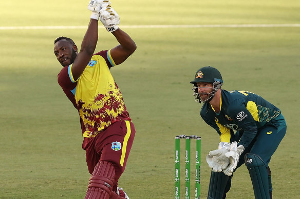 Andre Russell goes after Adam Zampa.