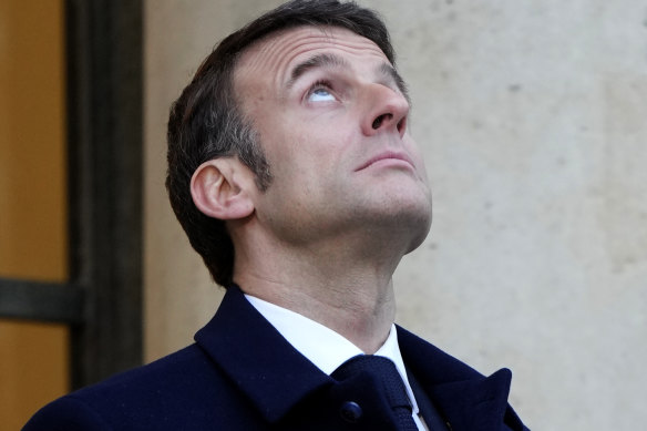 French President Emmanuel Macron waits for European heads of state at the Elysee Palace in Paris on Monday.