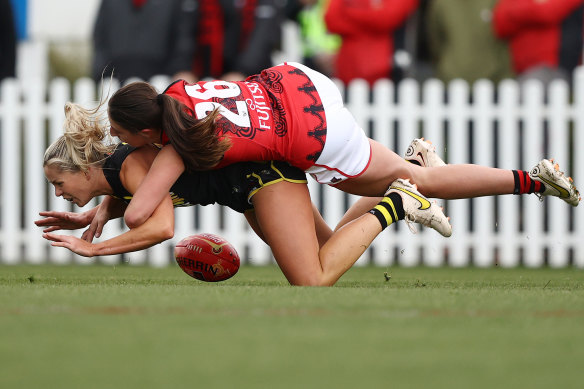 Katie Brennan of the Tigers is tackled by Essendon’s Ashleigh Van Loon.