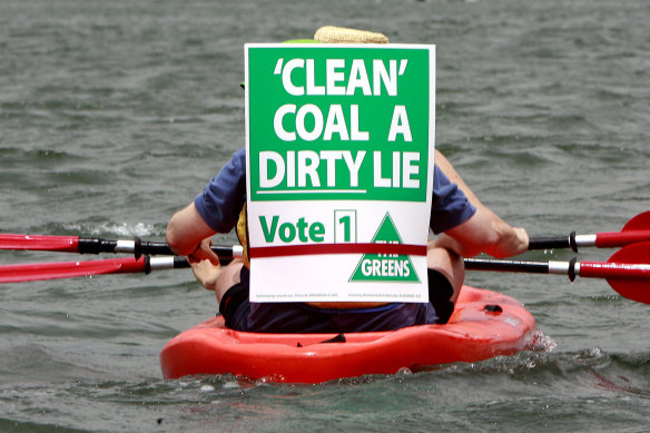 Activists paddle in the Rising Tide protest last November.