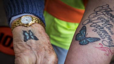 Both Pams have a blue butterfly tattoo on their wrist.