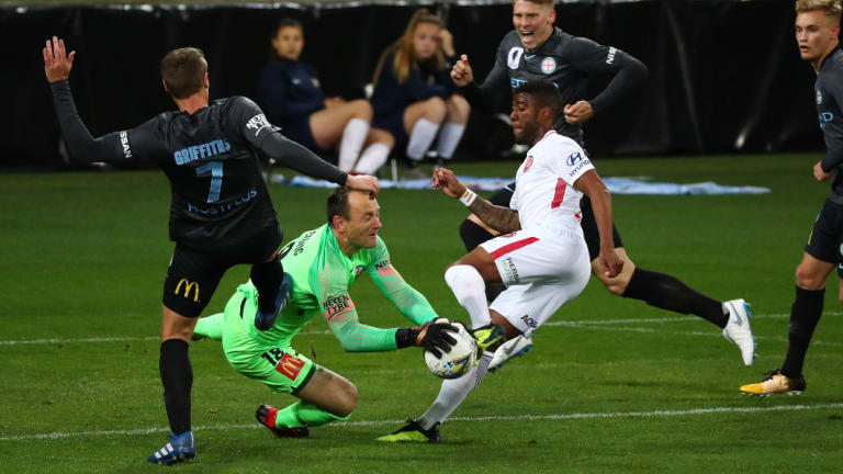 Eugene Galekovic beats Rolieny Bonevacia to the ball.