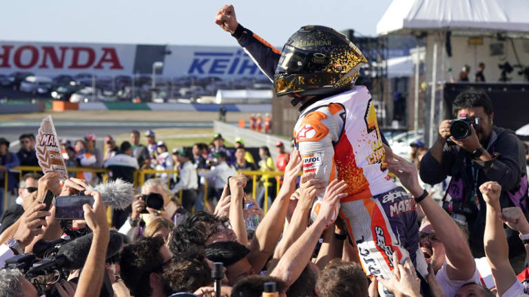 Marc Marquez celebrates with his team after victory in Japan.