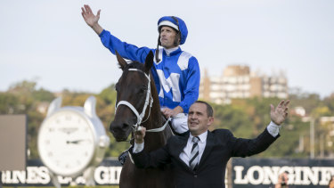 Goodbye to all that: Hugh Bowman and Chris Waller wave to fans at Randwick after Winx raced into retirement.