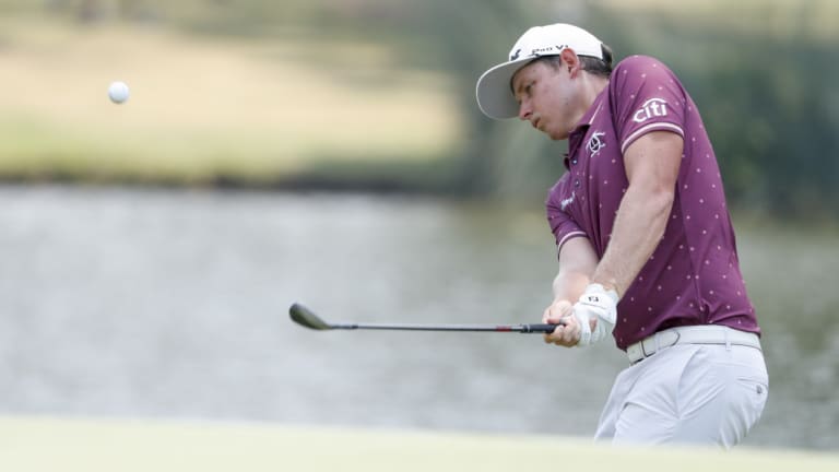 Local hero: Queenslander Smith plays a chip to the green on the final day.