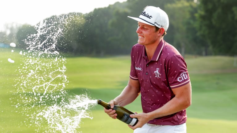 Bubbling over: Cameron Smith celebrates after successfully defending his PGA title at Royal Pines.
