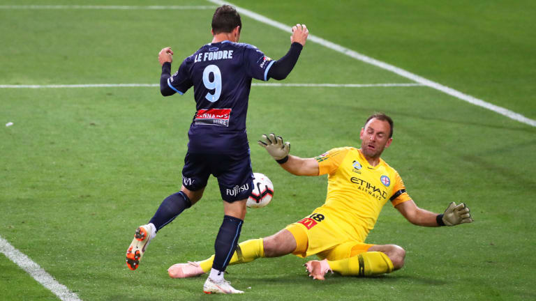 Sydney FC's Adam Le Fondre chips City goalkeeper Eugene Galekovic.