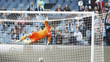 High dive: Western United goalkeeper Filip Kurto was kept busy by Melbourne City.