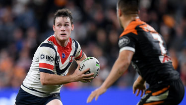 Back in action: Luke Keary shapes to pass against the Tigers.