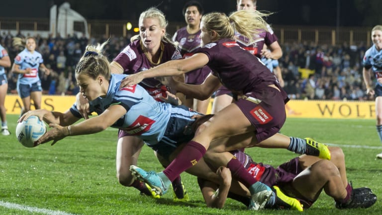Breakthrough: Isabelle Kelly of the Blues scores the match winner during the State of Origin at North Sydney Oval. 