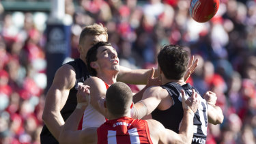 On point: Tom McCartin of the Swans takes a mark against the Blues.