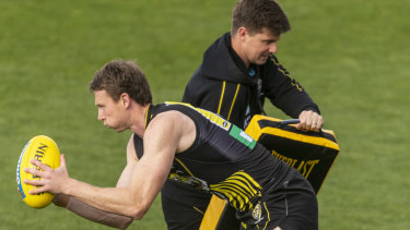On the prowl: Dylan Grimes puts in the hard yards during a Richmond training session at Punt Road Oval.