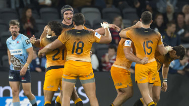 South American dreaming: The Jaguares celebrate victory over the Waratahs on Saturday.