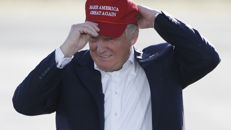 If the cap fits: Donald Trump campaigning in June 2016 in the trademark hat.