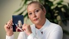 Virginia Giuffre, with a photo of herself as a teen, when she said she was abused by Jeffrey Epstein, Ghislaine Maxwell and Prince Andrew, among others.