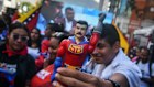 A demonstrator holds a “Super Bigote” superhero doll during a youth march for the release of Nicolás Maduro and Cilia Flores. The political fallout of Maduro’s detention by the US has been good for Venezuelan financial assets. 