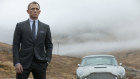 James Bond (Daniel Craig) and his trusty Aston Martin DBS.