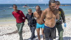 Key West Police and US Border Patrol officers take some of the Cuban migrants into custody at Fort Zachary Taylor State Park last year. 