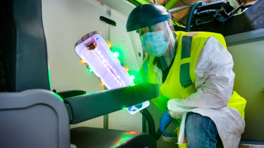 Boeing and other companies are scrambling to restore consumer confidence in air travel, with research in COVID transmission, and devices such as this ultraviolet (UV) wand to disinfect cabins.