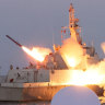 North Korea’s Kim visits missile tests as ‘invasion rehearsal’ drills begin