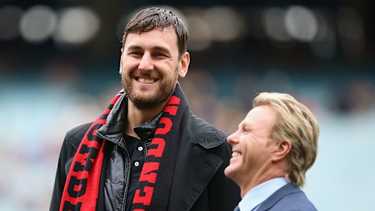 Andrew Bogut with Hawthorn great Dermott Brereton.