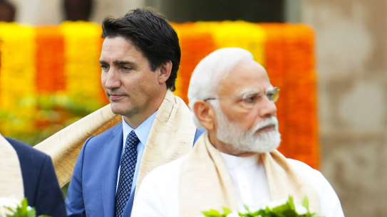 Canada’s Prime Minister Justin Trudeau walks past Indian Prime Minister Narendra Modi in Delhi in September.