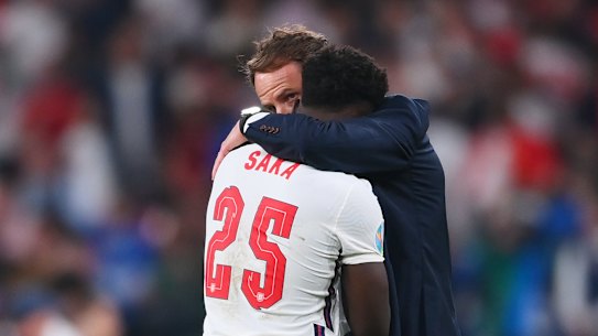 England manager Gareth Southgate consoles Bukayo Saka after the defeat
