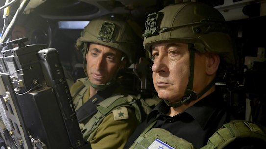 Israel’s Prime Minister Benjamin Netanyahu sits in a military vehicle during his Rafah visit.