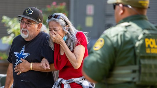 A woman cries as she leaves the Uvalde Civic Centre.