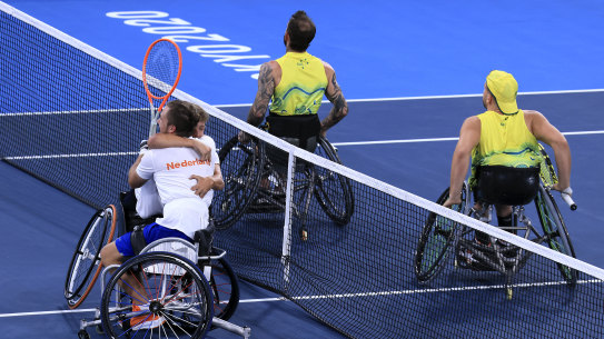 Sam Schroder and Niels Vink of the Netherlands celebrate winning a gold medal against Dylan Alcott and Heath Davidson in the men’s quad doubles tennis event. 