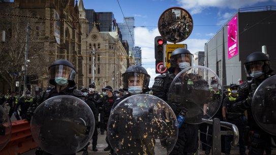 21/08/21 Thousands of Anti Vax and Anti Lockdown protestors stormed the streets of Melbournes CBD and were met with heavy a police presence who used capsicum spray and tear gas bullets to disperse the crowd. Photograph by Chris Hopkins