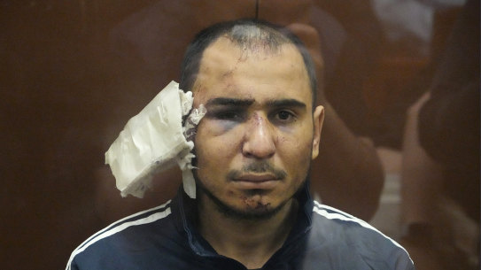 Saidakrami Murodali Rachabalizoda, a suspect in the Crocus City Hall shooting, with facial injuries and a large bandage on his ear. 