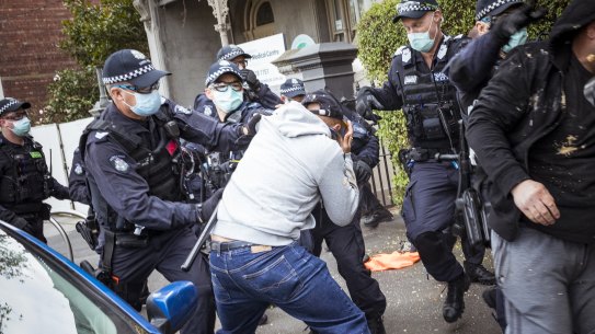 Protesters clash with police in North Melbourne on Saturday.