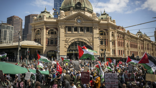 Pro-Palestine protesters outside Flinders Street Station in Melbourne on Sunday.