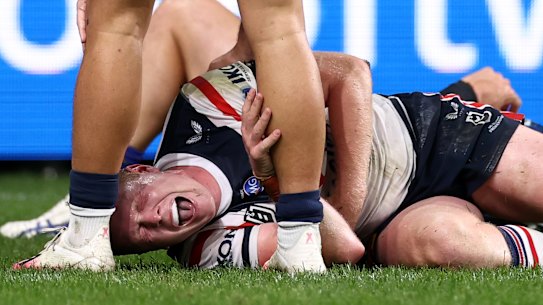 Drew Hutchison in pain after the hit from Dylan Brown. 