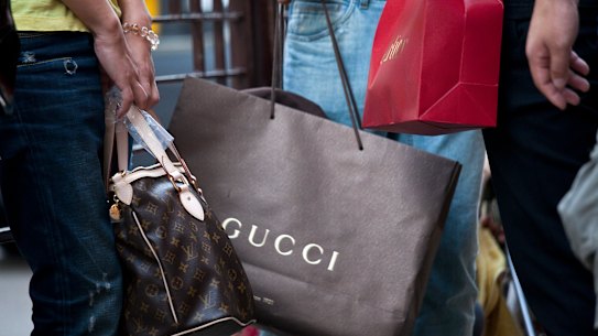 Luxury brands such as Gucci and Cartier have pocketed millions in JobKeeper while hiking their profits.
