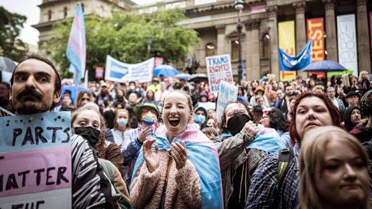 Transgender rights activists demonstrate outside the Victorian parliament in 2022.