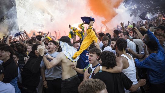 Soccer fans let off flares before   watching Australia take on Argentina at Federation Square.
