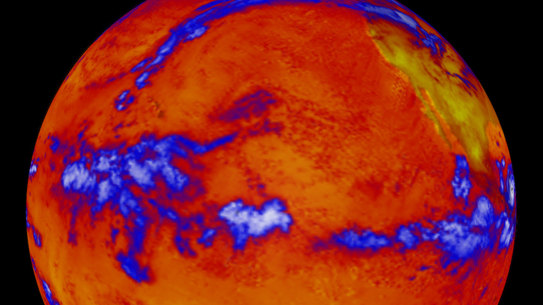 A false-colour image from 2001 showing where more or less heat, measured in long-wave radiation, was emanating.  The thermal radiation leaving the oceans is fairly uniform. The blue represent thick clouds, the top of which are cold.