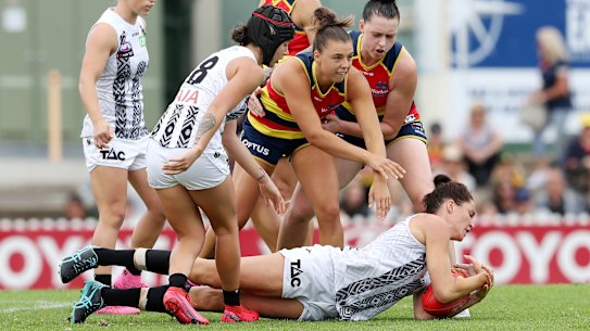 ADELAIDE, AUSTRALIA - MARCH 28: Sharni Layton of the Magpies in action with Ebony Marinoff from the Crows during the 2021 AFLW Round 09 match between the Adelaide Crows and the Collingwood Magpies at Norwood Oval on March 28, 2021 in Adelaide, Australia. (Photo by Sarah Reed/AFL Photos via Getty Images)