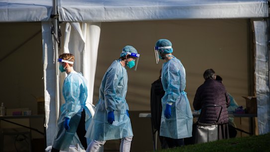 Health officials at a pop-up testing site outside the towers on Sunday.