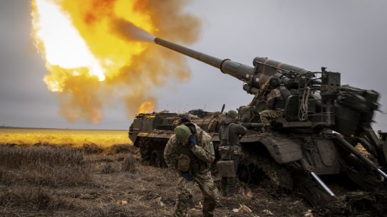 krainian artillerymen fire a 2S7 Pion cannon toward Russian fortifications inside the city of Kreminna.