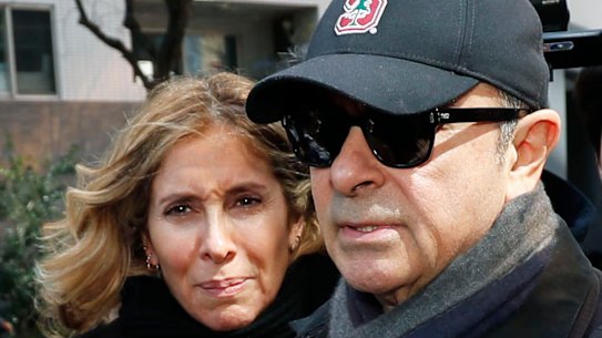 Former Nissan Chairman Carlos Ghosn, right, and his wife Carole, pictured in Tokyo in 2019.
