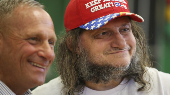 New Hampshire Republican U.S. Senate candidate Don Bolduc, left, poses with a voter.