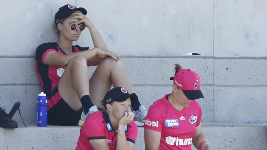 Ash Gardner nurses a sore head after being forced out of the WBBL match against Adelaide at Drummoyne Oval.