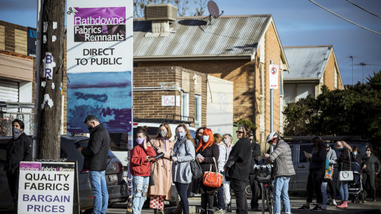 Long queues at Rathdowne Fabrics  in Brunswick, as people look to source material for facemasks due to the government regulation to make face coverings mandatory. 