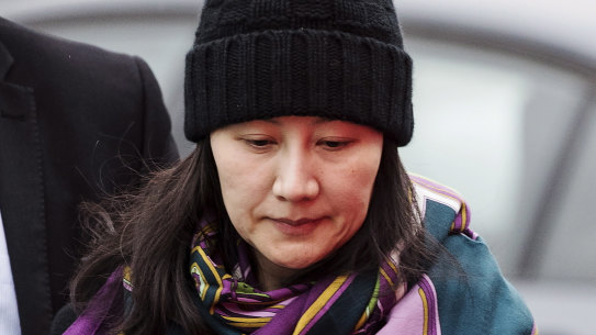 Huawei chief financial officer Meng Wanzhou arrives at a parole office with a security guard in Vancouver in December.
