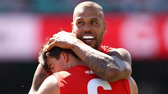 Logan McDonald celebrates kicking a goal with Lance Franklin.