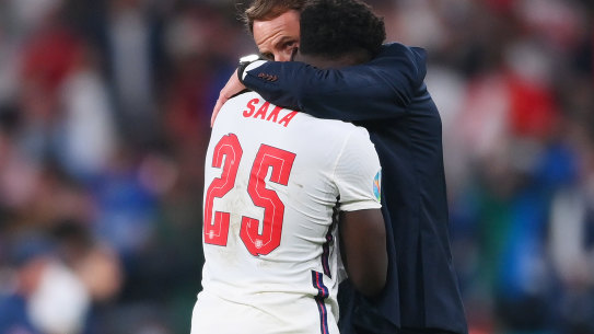 England manager Gareth Southgate consoles Bukayo Saka after the defeat